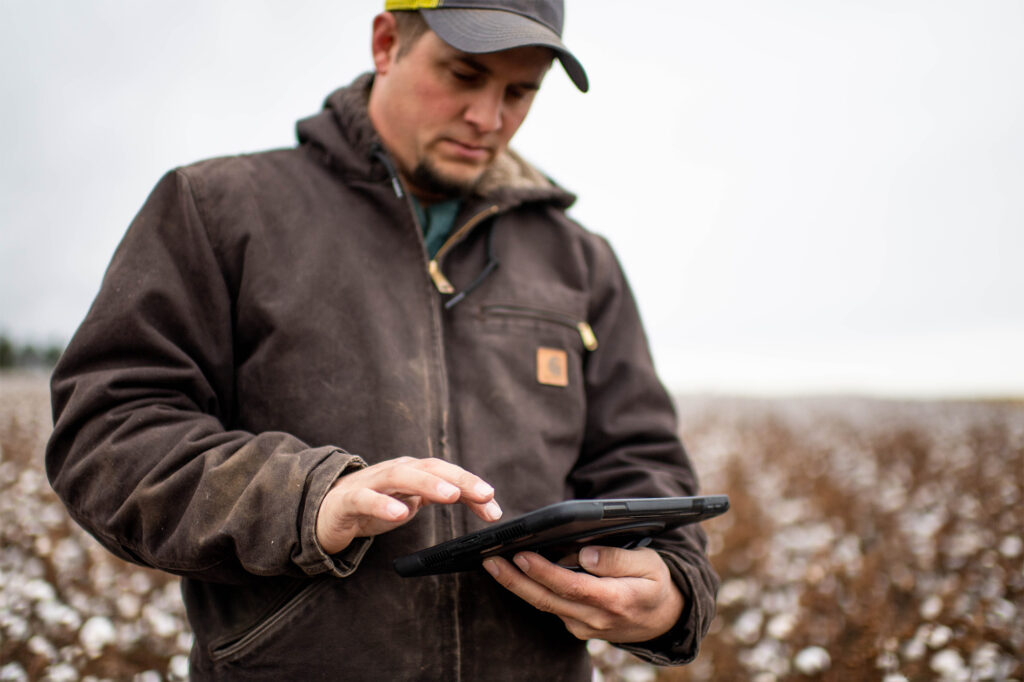 Farmer using tech in cotton field